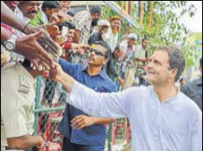  ?? PTI FILE ?? Congress President Rahul Gandhi greets his supporters during a rally ahead of the Karnataka Assembly polls in Bengaluru.