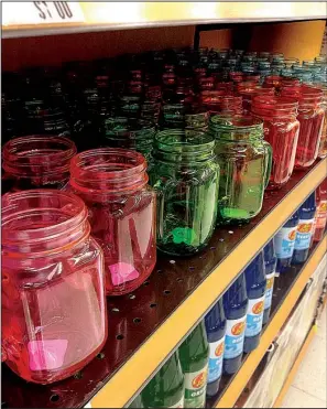  ?? Arkansas Democrat-Gazette/LINDA S. HAYMES ?? Mason-style jars are popping up more often in crafting stores and grocery stores. These handled ones, which come in a variety of colors, were recently found in a Kroger in Little Rock.