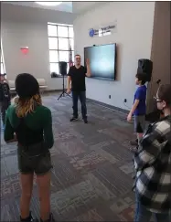  ?? ?? Break a leg: VVS graduate Tim Collins, a profession­al actor, teaches elementary school students exercises to teach them focus and energy while on stage.