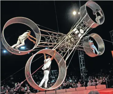  ??  ?? IN A SPIN: The Diorio Boys performing their fearless acrobatic act on a fast-spinning, double giant wheel.