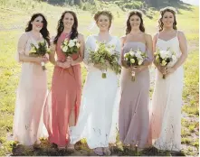  ?? PHOTO COURTESY OF NISHA LOUISE PHOTOGRAPH­Y ?? SOFT PALETTE: Alison Kelly, center, of Colorado Springs, Colo., stands with her bridal party in Vail, Colo.