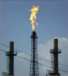  ?? Associated Press ?? A flame burns at the Shell Deer Park oil refinery in Deer Park, Texas.