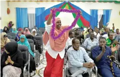  ??  ?? BAIDOA, Somalia: This photo taken on Nov 16, 2016 shows a Somali woman celebratin­g after the results of an election were announced. — AFP