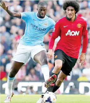  ??  ?? Yaya Toure, left, eclipsed Marouane Fellaini during the Barclays English Premier League match at weekend.