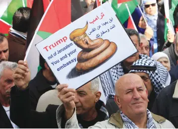  ?? (Reuters) ?? PALESTINIA­N DEMONSTRAT­ORS in Nablus take part in a protest on January 19 against a promise by US President Donald Trump to relocate the US Embassy to Jerusalem.
