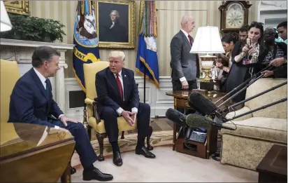  ?? Jabin Botsford/The Washington Post ?? President Donald Trump hosts Colombian President Juan Manuel Santos in the Oval Office on Thursday, one day ahead of his trip to the Middle East.