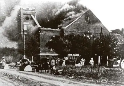  ?? Courtesy Greenwood Cultural Center ?? In this file image, Mt. Zion Baptist Church burns after being torched by white mobs during the 1921 massacre in Tulsa, Okla. President Donald Trump plans to host a rally in Tulsa on the Juneteenth holiday, drawing criticism from black community and political leaders.