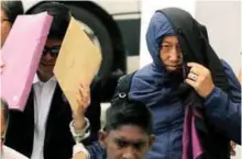  ??  ?? Left: See (right) and Kamal at the sessions court yesterday. Right: Lufti arriving at the court complex.