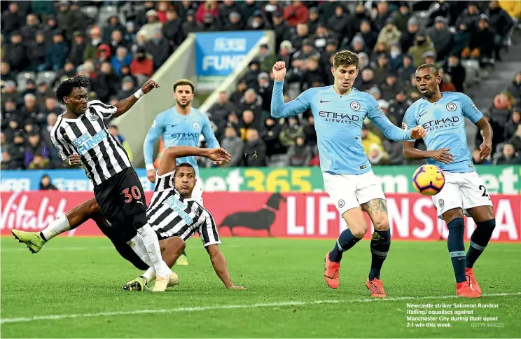  ?? GETTY IMAGES ?? Newcastle striker Salomon Rondon (falling) equalises against Manchester City during their upset 2-1 win this week.