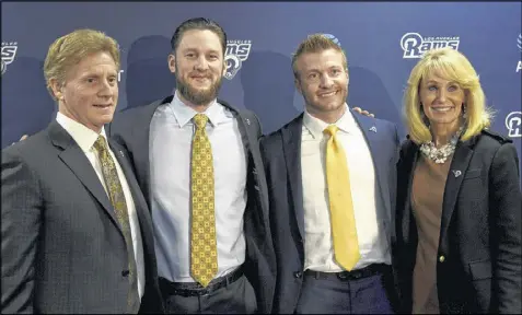  ?? MICHAEL OWEN BAKER / ASSOCIATED PRESS ?? The Los Angeles Rams’ new head coach, Sean McVay (second from right), is flanked by (from left) his father, Tim; brother, Ryan; and mother, Cindy, after a news conference announcing his hiring.