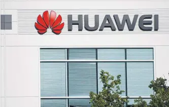  ?? YICHUAN CAO TRIBUNE NEWS SERVICE FILE PHOTO ?? Beijing sees an easing of restrictio­ns on Huawei as a preconditi­on for any trade deal with Washington.