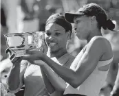  ?? DARRON CUMMINGS AP ?? Serena Williams, left, and sister Venus were given a wild card to compete in the U.S. Open doubles.