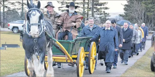  ?? COLIN MACLEAN/JOURNAL PIONEER ?? Gary Allen, left, and Elwin Sharpe drove Mickey the Clydesdale as she carried the casket of their friend, Wayne Bernard, to his final resting place in Springbroo­k on Wednesday.