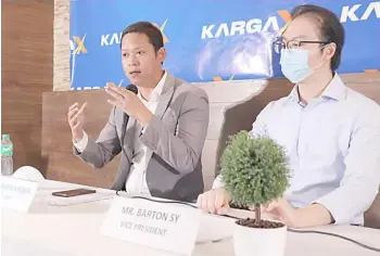  ?? PHOTOGRAPH COURTESY OF KARGAX ?? KARGAX president Kristofer Montebon (left), and vice president Barton Sy (right) discuss how KargaX will be beneficial to the country as the first nationwide trucking web and mobile platform.
