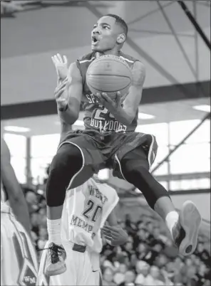  ?? NWA Democrat-Gazette/JASON IVESTER ?? Springdale senior Chris Owens leaps toward the basket for a shot against West Memphis on Friday during the Class 7A state tournament at Springdale Har-Ber. Owens finished with 25 points and Springdale won 53-39.