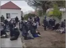  ?? UGC VIDEO VIA AP ?? In this image taken from amateur video, police detain a large number of students Thursday at Mantes-la-Jolie, France.