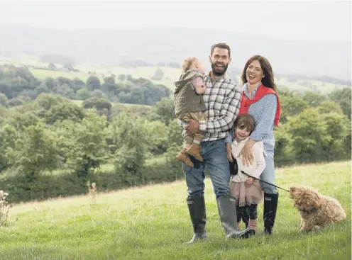  ?? PICTURE: BBC/JON PARKER LEE. ?? DOWN ON THE FARM: Kelvin Fletcher with his wife Liz and their children in a scene from Kelvin’s Big Farming Adventure.