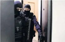  ?? PHOTO: REUTERS ?? Raids . . . Law enforcemen­t officers leave a property of Russian opposition leader Alexei Navalny during a raid in Moscow, Russia, yesterday.