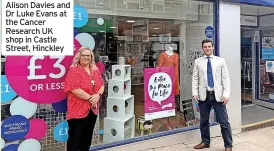  ??  ?? Alison Davies and Dr Luke Evans at the Cancer Research UK shop in Castle Street, Hinckley