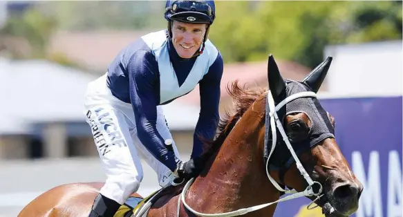  ?? Photo: DAN PELED ?? THAT WINNING FEELING: Jockey Dan Griffin returns to scale after guiding Toowoomba gelding Mr Markou to victory in the Magic Millions Country Cup on Saturday. The Ben Currie-trained five-year-old claimed $150,000 for the win.