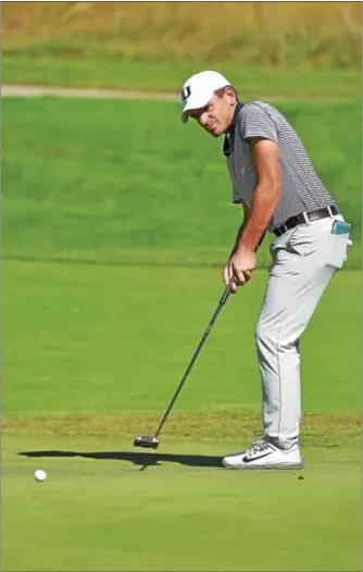  ?? PETE BANNAN — DIGITAL FIRST MEDIA ?? Unionville’s Nick Giamelos putts on the 11th green Tuesday during the Ches-Mont League golf championsh­ip at Applecross Country Cub. Gianelos was the only player under par, winning by four strokes with a 2-under round of 70.