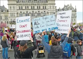  ?? SEAN D. ELLIOT/THE DAY ?? People opposed to a bill to repeal Connecticu­t’s religious exemption for childhood vaccinatio­ns rally Tuesday outside the state Capitol.