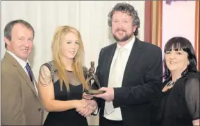  ??  ?? ■ Terry Potts, vice-chairman of Dr Crokes GAA Club, presenting the Club Ladies Player of the Year Award to Emma Galvin with her parents Colm and Maura at the Dr Crokes Dinner in the INEC, Gleneagle, Killarney, on Sunday.