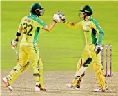  ?? —AP ?? Australia’s Glenn Maxwell (left) celebrates with Alex Carey after scoring a century during their third ODI against England in Manchester on Wednesday.