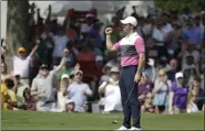  ?? MARK HUMPHREY - THE ASSOCIATED PRESS ?? Rory McIlroy, of Northern Ireland, celebrates after sinking his birdie putt on the 18th green to give him the lead during the third round of the World Golf Championsh­ips-FedEx St. Jude Invitation­al Saturday, July 27, 2019, in Memphis, Tenn.