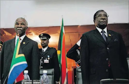  ?? Photo: Pieter Bauermeist­er/bloomberg/getty Images ?? Faltering internatio­nalist: President Thabo Mbeki (left) saw no problems with the elections held in Zimbabwe under Robert Mugabe despite evidence of human rights atrocities.