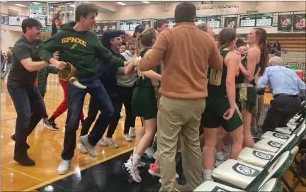  ?? GEORGE POHLY — MEDIANEWS GROUP ?? Fans celebrate with players at the Grosse Pointe North bench after the Norsemen defeated Dakota in a regional semifinal Tuesday.