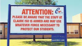  ?? CREEDE NEWTON/ASSOCIATED PRESS ?? A sign at the school in Claude, Texas, captures one side of the issue of arming school teachers and staff against the threat of attacks.