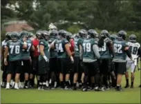  ?? MATT ROURKE — THE ASSOCIATED PRESS ?? Members of the Philadelph­ia Eagles gather during NFL football training camp in Philadelph­ia, Tuesday.