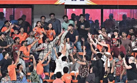  ?? K.R. DEEPAK ?? Fans trying to catch a sixer during the Indian Premier League (IPL) Twenty20 cricket match between Sunrisers Hyderabad and Mumbai Indians at the Rajiv Gandhi Internatio­nal Stadium in Hyderabad on Wednesday.