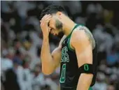  ?? WILFREDO LEE/AP ?? Jayson Tatum and the second-seeded Celtics lost 128-102 to the eighth-seeded Heat on Tuesday night in Miami and trail 3-0 in the Eastern Conference finals.