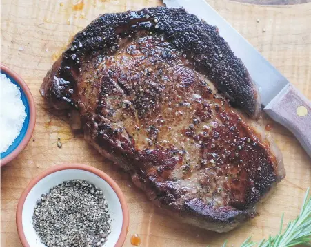  ??  ?? A flavourful dry-aged, rib eye steak is best served seasoned with just salt and pepper and seared to your liking.