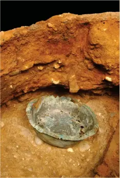  ??  ?? Above: Small copper-alloy bowl inside the tub (c 17cm across)