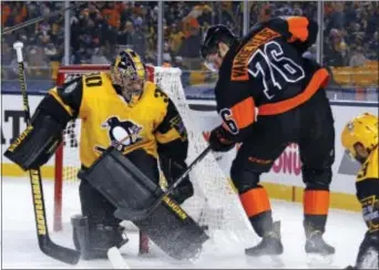  ?? GENE J. PUSKAR — THE ASSOCIATED PRESS ?? Penguins goalie Matt Murray (30) blocks a shot by Chris VandeVelde (76) in the second period of an NHL Stadium Series game at Heinz Field in Pittsburgh, Saturday.