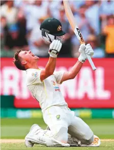  ?? AFP ?? ■
David Warner celebrates his double century on the second day of the second Test against South Africa in Melbourne.