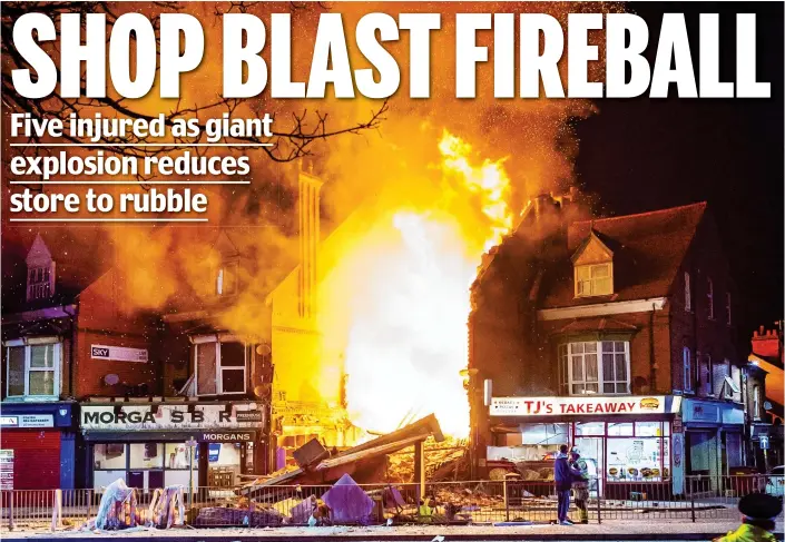  ??  ?? Collapse: Huge flames leap from the remains of the two-storey convenienc­e store in Leicester last night after it was almost totally destroyed by an explosion