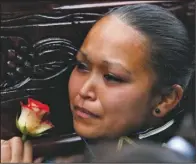  ??  ?? TEARS: A student, member of the school marching band cries as she carries the coffin of her classmate and fellow band member Bryan Sandoval who died in a mudslide to the Santa Catarina Pinula cemetery Sunday on the outskirts of Guatemala City. Hope...