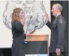  ?? MICHAEL SEARS / MILWAUKEE JOURNAL SENTINEL ?? Chief of Police Edward Flynn takes the oath of office from Milwaukee Fire and Police Commission Executive Director MaryNell Regan at the Milwaukee Safety Academy in 2016.