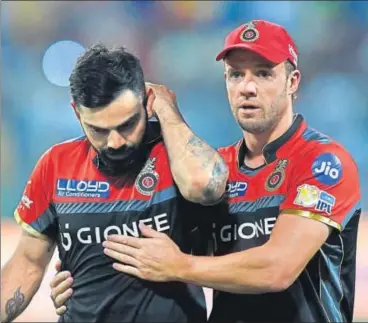  ?? AFP ?? Royal Challenger­s Bangalore captain Virat Kohli and AB de Villiers seem to be in a daze after the humiliatin­g loss on Sunday.