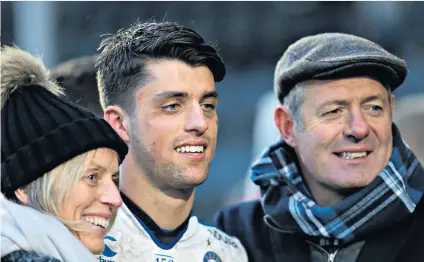  ??  ?? Keeping it in the family: Fly-half Adam Hastings, here with his father Gavin, has impressed for Glasgow this season