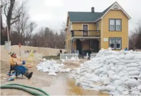  ??  ?? DaleVonTal­gemonitors two pumps pullingwat­er froma stressed street drain in Kimmswick, Mo. Floodwater­swere receding in some areas. Laurie Skrivan, St. Louis Post- Dispatch