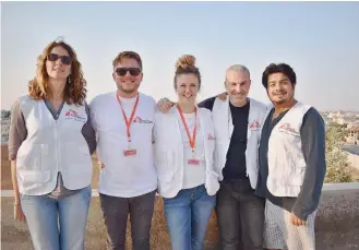  ??  ?? Vangelis Kassotakis (2nd right) recently returned from his first mission, in Ramtha, Jordan.