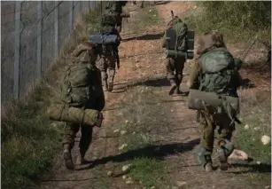  ?? (IDF) ?? IDF COMMANDOS march during the 10-day exercise.