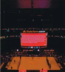  ?? KEVIN C. COX — GETTY IMAGES ?? The Atlanta Hawks and Orlando Magic observe the guilty verdicts in the Derek Chauvin case prior to the game at State Farm Arena on Tuesday.