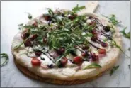  ?? PHOTO COURTESY OF WEAVER’S ORCHARD ?? Expand your pizza horizons with cherries, arugula and goat cheese