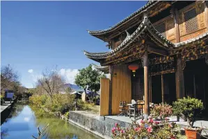  ?? ZHANG KAIXIN / FOR CHINA DAILY ?? A rural landscape featuring old buildings in the ancient town of Heshun in Tengchong, Yunnan province.